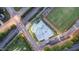 Aerial view featuring a modern skate park near a recreational field and train tracks at 417 E Moore St, Apex, NC 27502