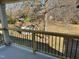 Large back porch with railings offers backyard views at 417 E Moore St, Apex, NC 27502