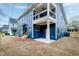 Backyard of home showing patio, balcony, and new construction landscaping at 417 E Moore St, Apex, NC 27502