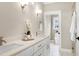 Elegant bathroom with dual sinks, quartz countertop, and glass shower at 417 E Moore St, Apex, NC 27502