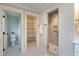 This primary bath features a storage closet, toilet room, and tiled shower at 417 E Moore St, Apex, NC 27502