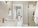 Bright bathroom featuring a walk-in shower and a toilet in separate area at 417 E Moore St, Apex, NC 27502