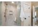 Bright bathroom featuring a glass enclosed shower with a built-in seat at 417 E Moore St, Apex, NC 27502
