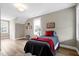 Bedroom with natural light from two windows and neutral paint to complement the wood floors at 417 E Moore St, Apex, NC 27502