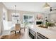 Bright eat-in kitchen boasts stainless steel appliances, breakfast nook and sliding doors to the backyard at 417 E Moore St, Apex, NC 27502