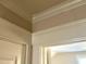 Close-up of the trim on the walls and doorway in a neutral colored room at 417 E Moore St, Apex, NC 27502