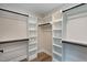 Spacious walk-in closet with multiple shelves and hanging rods at 417 E Moore St, Apex, NC 27502