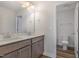 Bathroom featuring double sink vanity, recessed lighting, and view to the toilet area at 54 Barony Ln, Smithfield, NC 27577