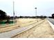 Spacious community ball field with well-maintained grounds, fencing, and lighting at 55 Streamline Ct, Lillington, NC 27546