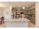 Bright kitchen with granite countertops, stainless steel appliances, and a center island for food prep at 55 Streamline Ct, Lillington, NC 27546