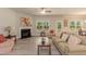 Spacious living room features a fireplace, ceiling fan, luxury vinyl floors and lots of natural light at 55 Streamline Ct, Lillington, NC 27546