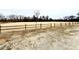 Open community green space with wooden fencing and natural surroundings at 55 Streamline Ct, Lillington, NC 27546
