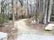 View of a well-maintained community walking trail surrounded by trees at 55 Streamline Ct, Lillington, NC 27546