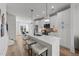 Bright kitchen with a quartz island, stainless steel appliances, and pendant lighting at 710 W North St # 103, Raleigh, NC 27603