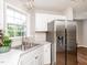 Stylish kitchen with stainless steel fridge and sink at 2227 Delaney Dr # 313, Burlington, NC 27215