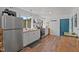 Bright kitchen featuring butcher block countertops, stainless steel appliances, and wooded views at 1021 Dimmocks Mill Rd, Hillsborough, NC 27278