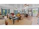 Open concept living room and dining area with comfortable seating and natural light at 1021 Dimmocks Mill Rd, Hillsborough, NC 27278