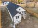 Aerial view of home showing the backyard, roof, and the surrounding fenced property at 1101 Ridge Rd, Roxboro, NC 27573