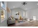 Spacious living room with ample natural light, wood flooring, and neutral color palette at 1101 Ridge Rd, Roxboro, NC 27573