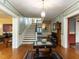 Grand entryway with hardwood floors, a staircase, and antique furniture at 1208 College Pl, Raleigh, NC 27605