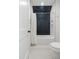 Modern bathroom with herringbone shower tiles, a white shower curtain, and light gray tiling at 60 Citori Ct, Pittsboro, NC 27312