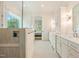 Bright bathroom featuring a walk-in shower, double vanity, and modern fixtures at 60 Citori Ct, Pittsboro, NC 27312