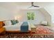 Spacious bedroom boasts natural light, hardwood floors, and stylish furniture at 60 Citori Ct, Pittsboro, NC 27312