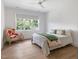 Bedroom with hardwood floors, ceiling fan, and a window that provides great natural light at 60 Citori Ct, Pittsboro, NC 27312