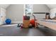 Well-equipped home gym with rubber flooring, free weights, and workout equipment at 60 Citori Ct, Pittsboro, NC 27312