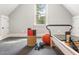 Exercise room with workout equipment, yoga mats, and natural light from window at 60 Citori Ct, Pittsboro, NC 27312