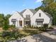 Stunning white brick home with a welcoming front porch and landscaping at 60 Citori Ct, Pittsboro, NC 27312