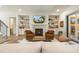 Cozy living room with built-in shelves, fireplace, and a sliding glass door at 60 Citori Ct, Pittsboro, NC 27312