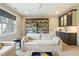 Cozy living room with comfortable seating, built-in shelving, and a wet bar at 60 Citori Ct, Pittsboro, NC 27312