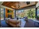 Comfortable outdoor living room featuring a fireplace, seating area, and view of the surrounding greenery at 60 Citori Ct, Pittsboro, NC 27312