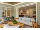 Relaxing outdoor living area leading indoors, with ample seating and a view of the outdoor seating area at 60 Citori Ct, Pittsboro, NC 27312