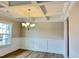 Elegant dining room featuring hardwood floors, tray ceiling, and wainscoting at 1055 Fairhaven Dr # 56, Mebane, NC 27302