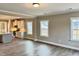 Spacious living room with hardwood floors and access to kitchen at 1055 Fairhaven Dr # 56, Mebane, NC 27302