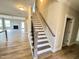 Modern staircase with metal balusters leading to the second floor at 1055 Fairhaven Dr # 56, Mebane, NC 27302
