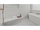 Bathroom showcasing a soaking tub, a tile shower with bench, and modern fixtures at 701 Dartmouth Rd, Raleigh, NC 27609