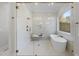 Bright bathroom featuring a glass shower and a freestanding tub with elegant finishes at 701 Dartmouth Rd, Raleigh, NC 27609