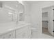 Bathroom showcasing white marble floors, a large mirror, and vanity with a walk in shower at 701 Dartmouth Rd, Raleigh, NC 27609