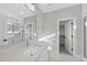 Bright bathroom featuring a mirror, vanity, toilet and tiled shower at 701 Dartmouth Rd, Raleigh, NC 27609