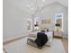 Spacious bedroom with high ceilings, large windows, and a chandelier at 701 Dartmouth Rd, Raleigh, NC 27609