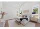 Bedroom with ample natural light, hardwood floors, and neutral decor at 701 Dartmouth Rd, Raleigh, NC 27609