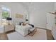 A clean and well-lit bedroom featuring multiple windows and hardwood floors at 701 Dartmouth Rd, Raleigh, NC 27609