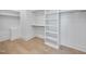 Walk-in closet with ample storage space and wooden floors at 701 Dartmouth Rd, Raleigh, NC 27609