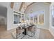 Elegant dining room featuring modern chandelier, large windows, and hardwood floors at 701 Dartmouth Rd, Raleigh, NC 27609