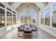 Bright dining room with vaulted ceiling, modern chandelier, and lots of natural light at 701 Dartmouth Rd, Raleigh, NC 27609