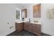 Functional laundry room with modern cabinets, quartz countertops, and a sink, offering convenience and efficiency at 701 Dartmouth Rd, Raleigh, NC 27609