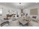 Open concept living room with views to the kitchen, hardwood floors and modern decor at 701 Dartmouth Rd, Raleigh, NC 27609